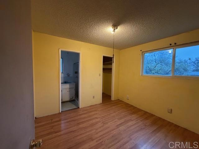 1366 Far Valley Road Campo, CA 91906 - Photo 6 of 26 a view of an empty room with wooden floor