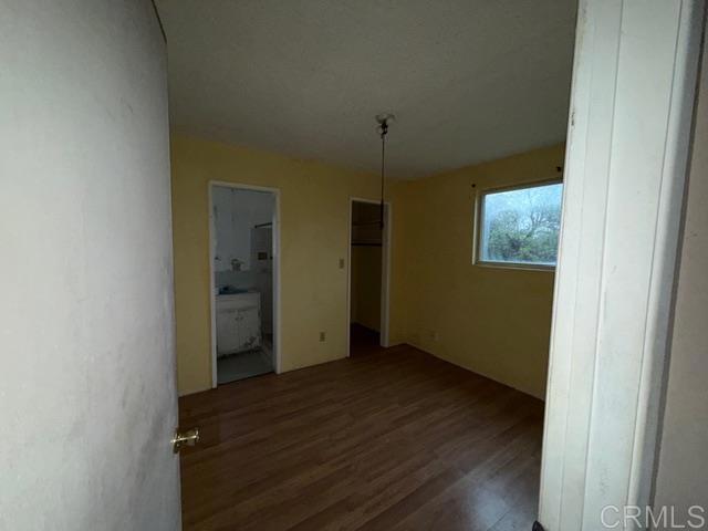 1366 Far Valley Road Campo, CA 91906 - Photo 9 of 26 an empty room with wooden floor and closet
