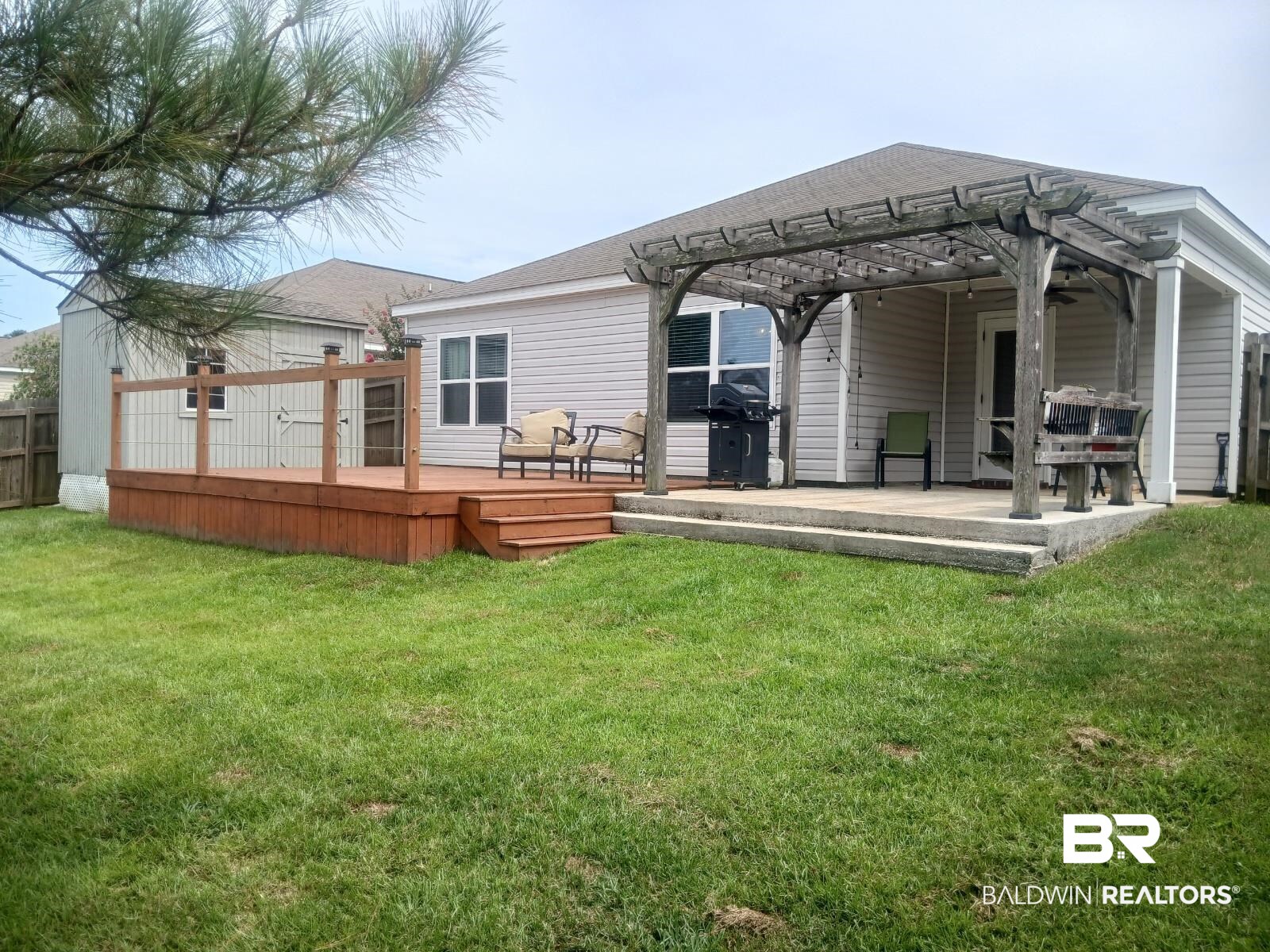 17431 Harding Drive Foley, AL 36535 - Photo 21 of 24 Rear view of property with a pergola, a yard, and a deck