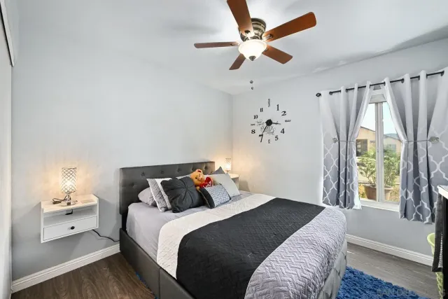 a bedroom with a large bed and a window