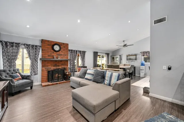 a living room with furniture and a fireplace