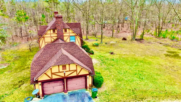 a kitchen with stainless steel appliances granite countertop a refrigerator a sink dishwasher a stove top oven a refrigerator with wooden cabinets and floor