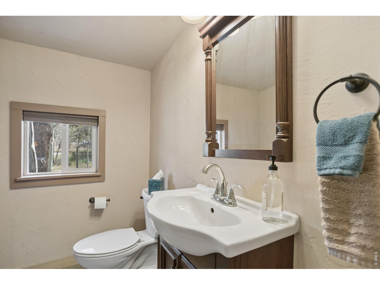 27 Gap Road Black Hawk, CO 80422 - Photo 4 of 36 a bathroom with a sink toilet and mirror