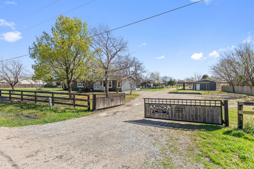 734 Northfork Road Royse City, TX 75189 - Photo 1 of 35 a view of outdoor space with garden and deck