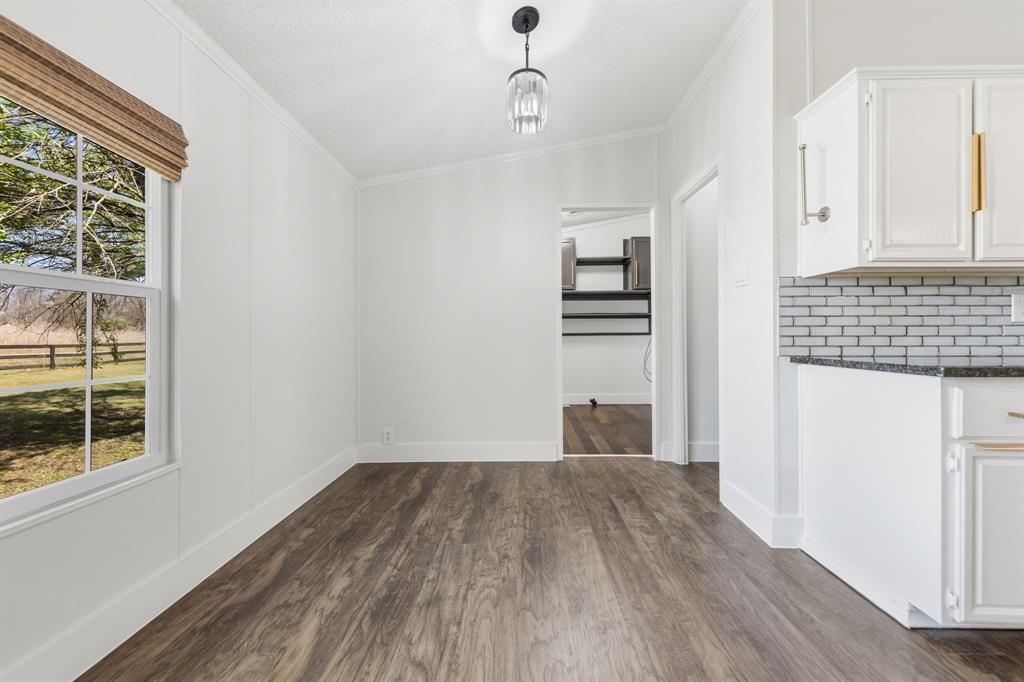 734 Northfork Road Royse City, TX 75189 - Photo 13 of 35 a view of a room with wooden floor closet and windows
