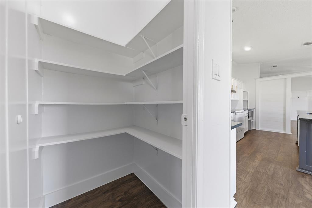 734 Northfork Road Royse City, TX 75189 - Photo 14 of 35 a view of a kitchen with a refrigerator and a cabinets