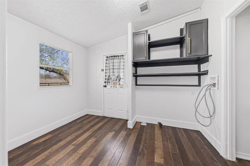 734 Northfork Road Royse City, TX 75189 - Photo 15 of 35 a view of a room with wooden floor and window