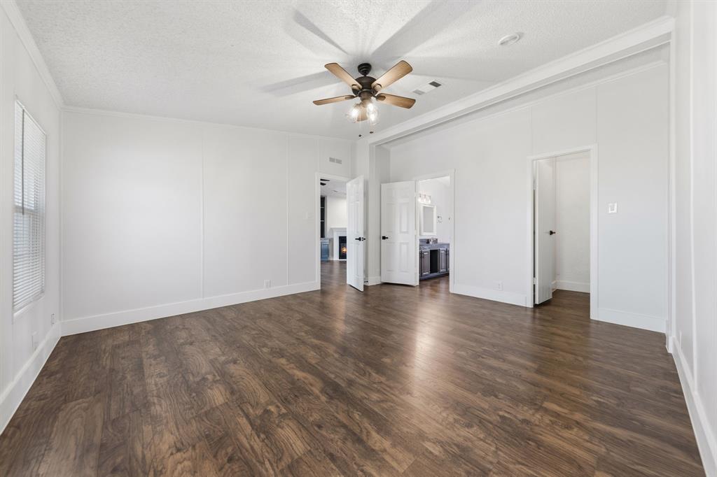 734 Northfork Road Royse City, TX 75189 - Photo 16 of 35 an empty room with wooden floor fan and a window