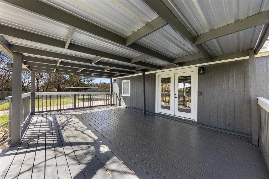 734 Northfork Road Royse City, TX 75189 - Photo 24 of 35 a view of an empty room with wooden floor and a window