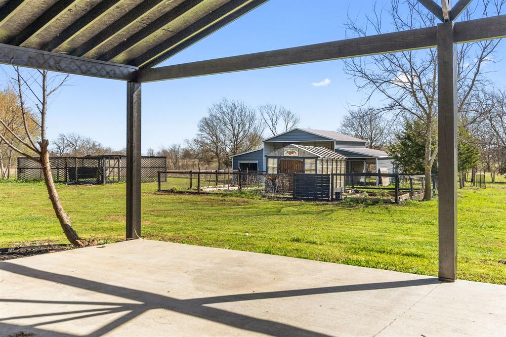 734 Northfork Road Royse City, TX 75189 - Photo 27 of 35 a front view of house with a garden and deck
