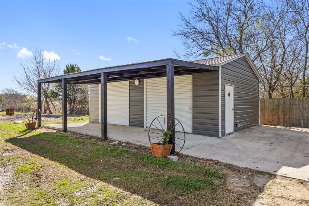 734 Northfork Road Royse City, TX 75189 - Photo 32 of 35 a view of a house with backyard and porch