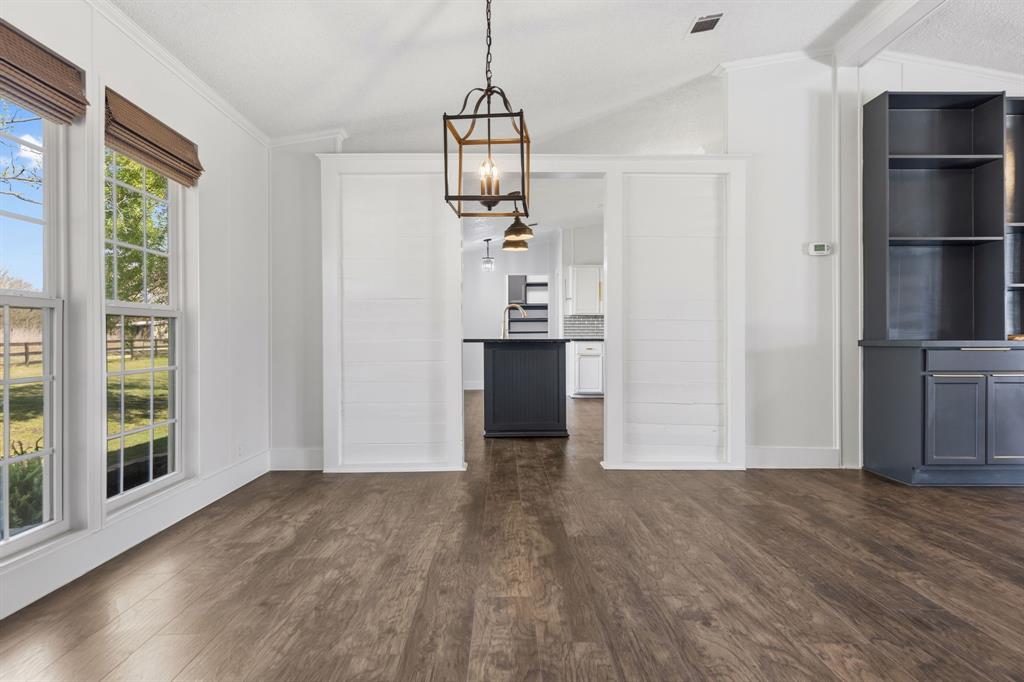734 Northfork Road Royse City, TX 75189 - Photo 6 of 35 a view of a kitchen with wooden floor and windows