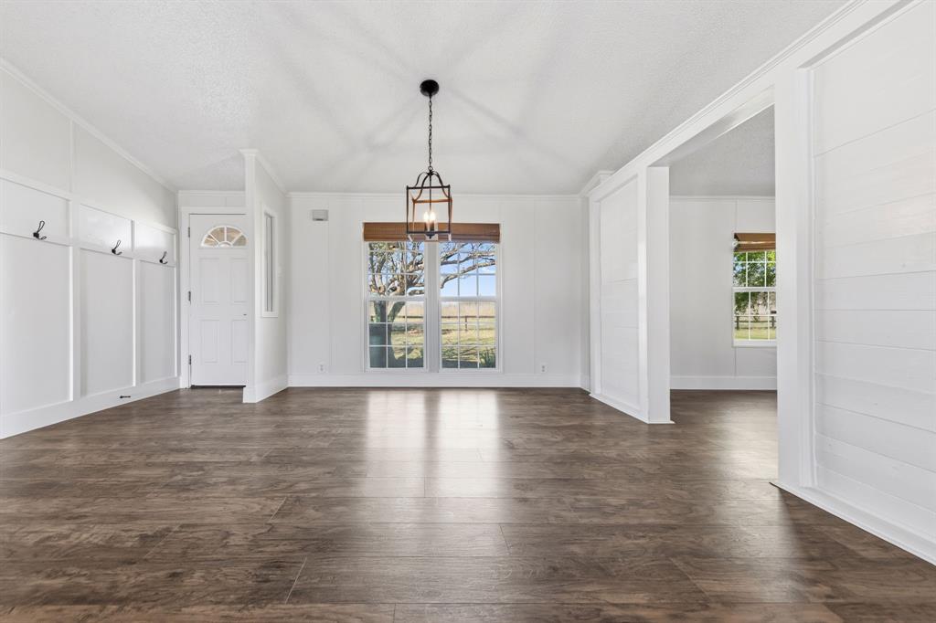 734 Northfork Road Royse City, TX 75189 - Photo 7 of 35 a view of an empty room with window and wooden floor