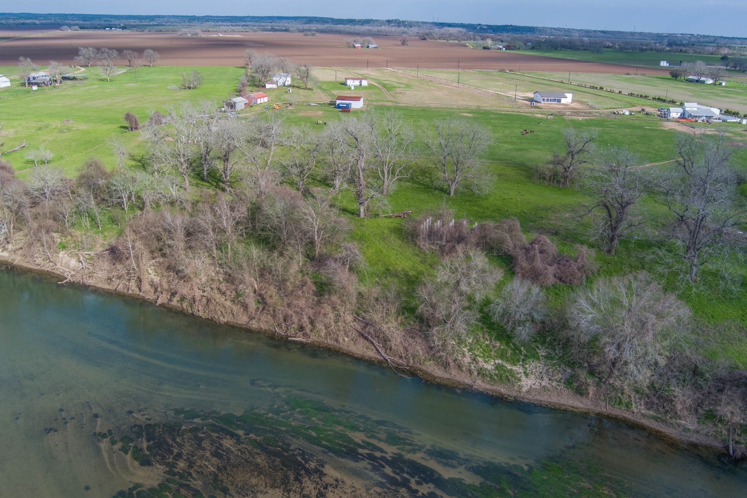 2940 Rabbs Prairie Road La Grange, TX 78945 - Photo 1 of 39 a view of a garden with a lake