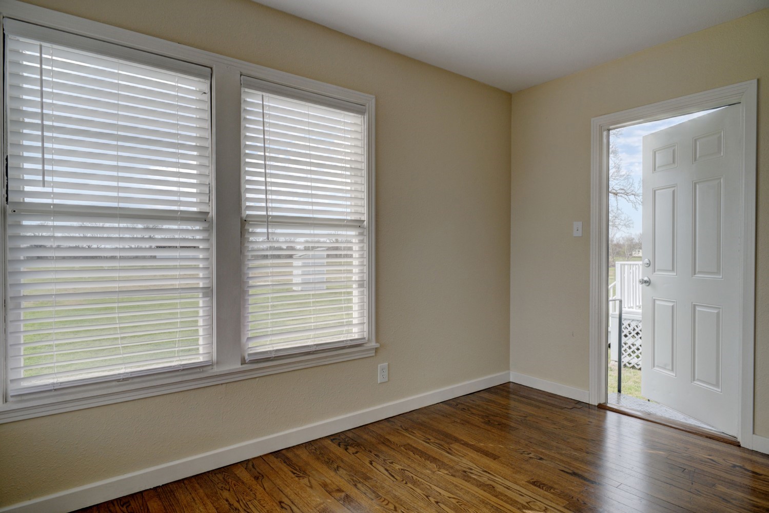 2940 Rabbs Prairie Road La Grange, TX 78945 - Photo 17 of 39 a view of an empty room with wooden floor and a window