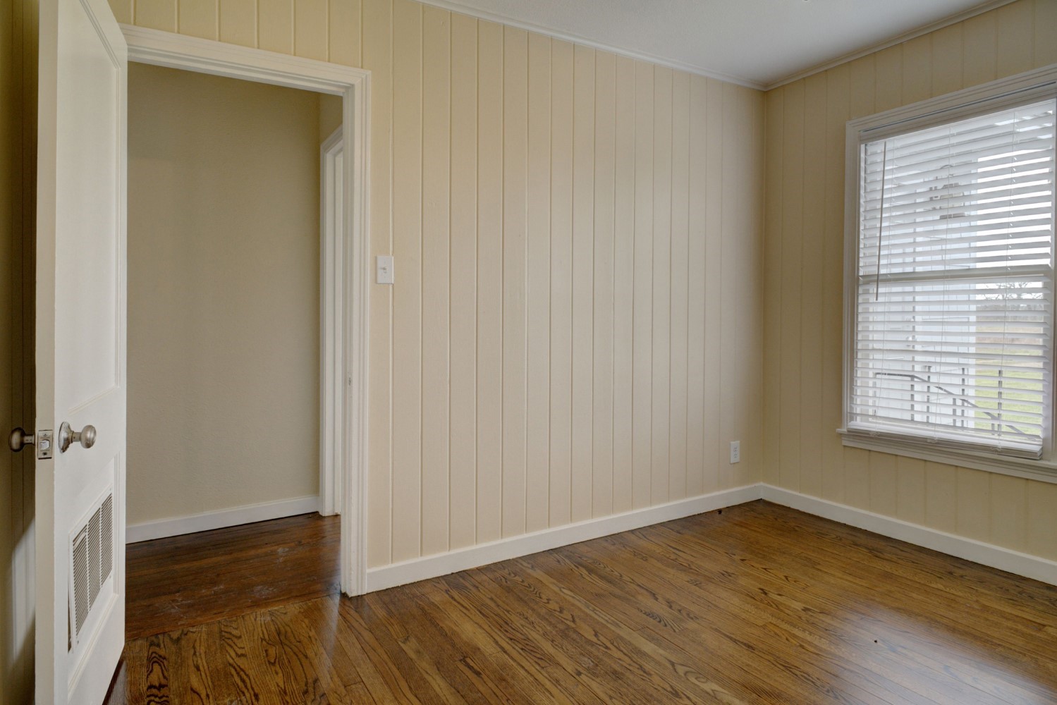 2940 Rabbs Prairie Road La Grange, TX 78945 - Photo 21 of 39 an empty room with wooden floor and windows