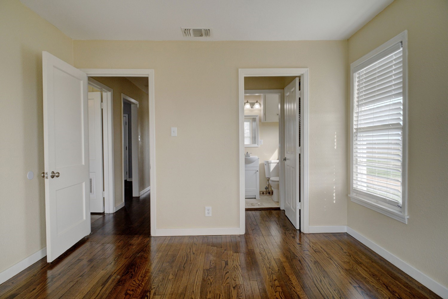 2940 Rabbs Prairie Road La Grange, TX 78945 - Photo 22 of 39 a view of an empty room with wooden floor and a window