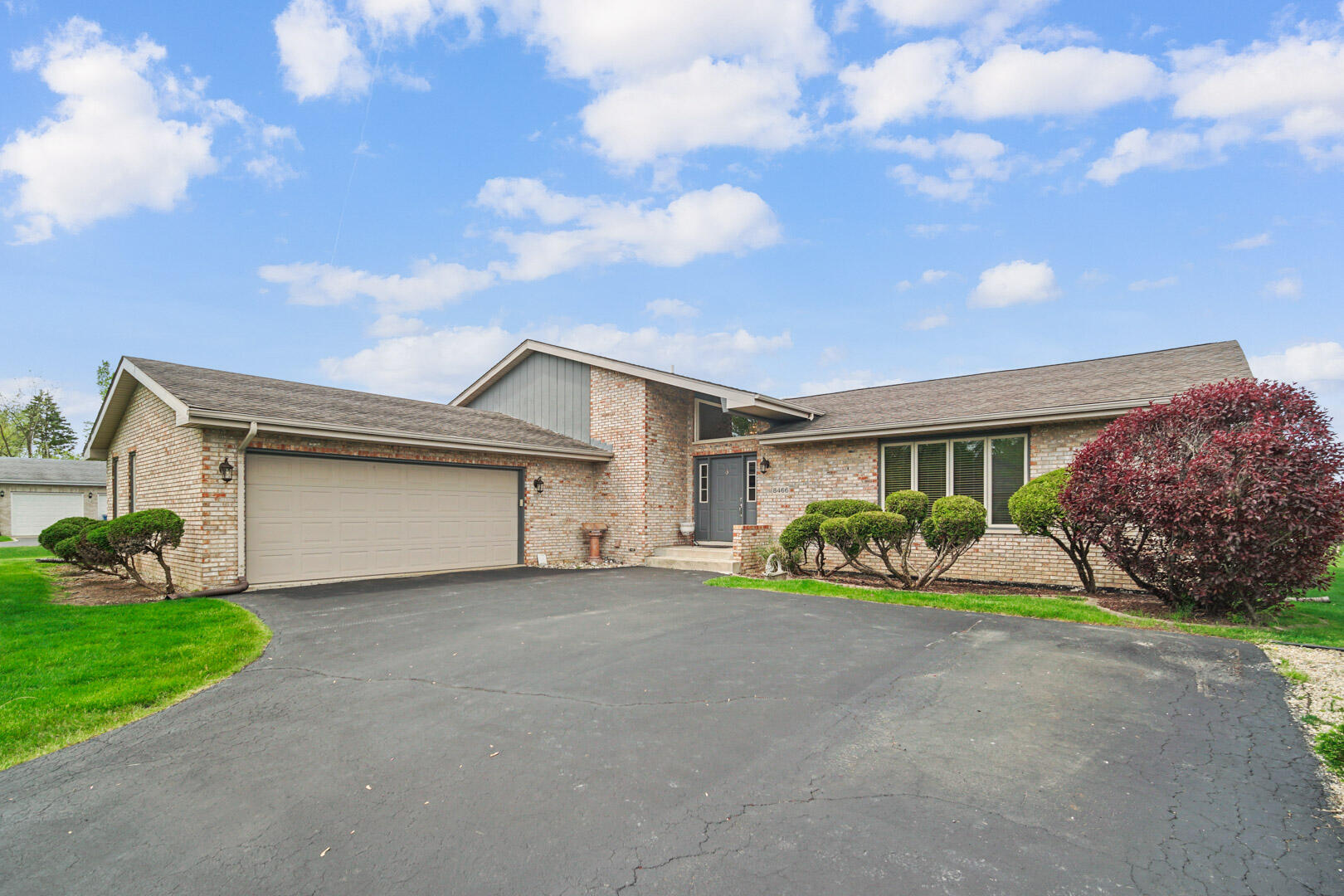 8466 Christopher Drive St. John, IN 46373 - Photo 2 of 23 a front view of a house with a yard and garage