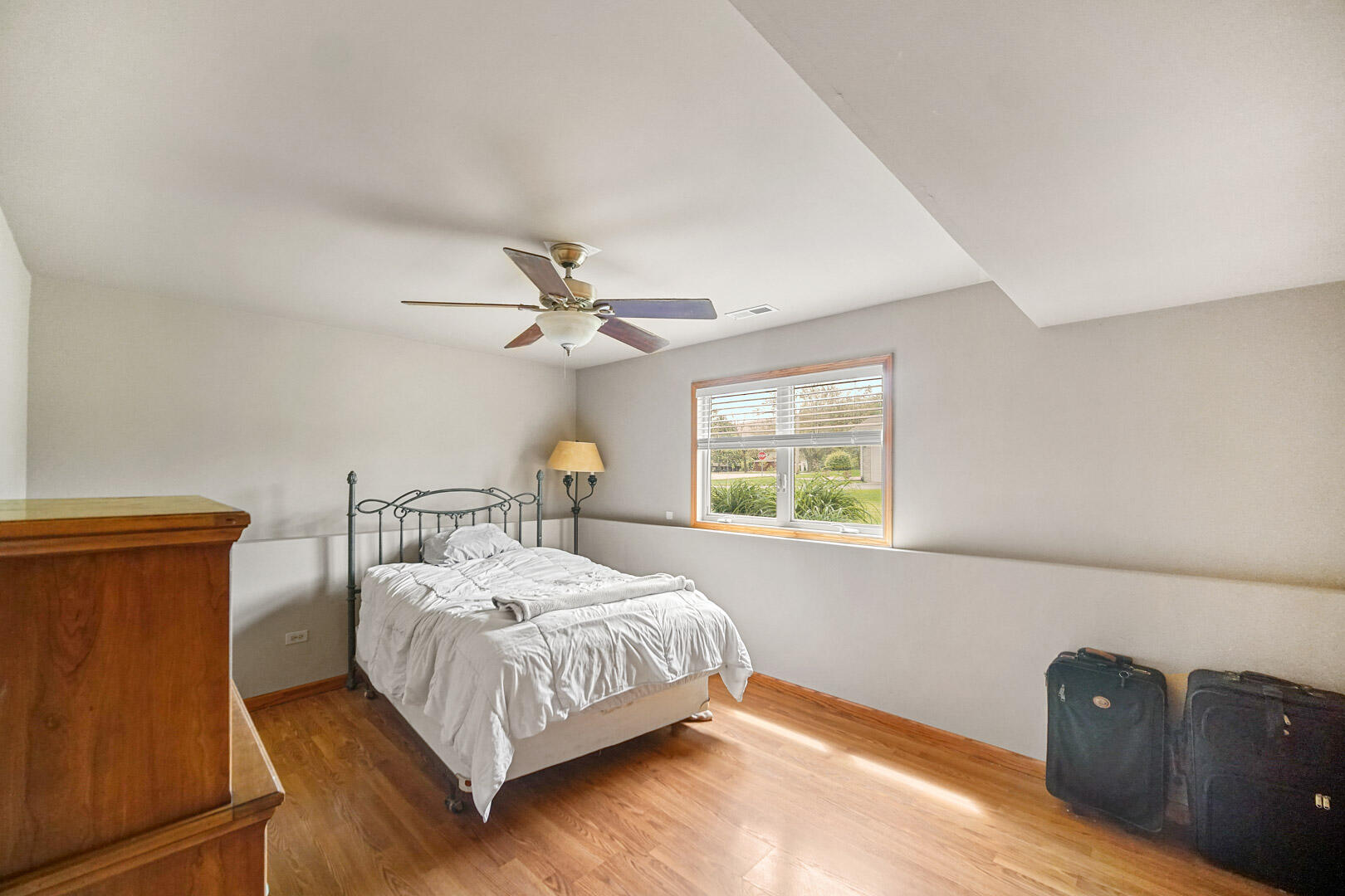 8466 Christopher Drive St. John, IN 46373 - Photo 23 of 23 a bedroom with a bed lamp and a window