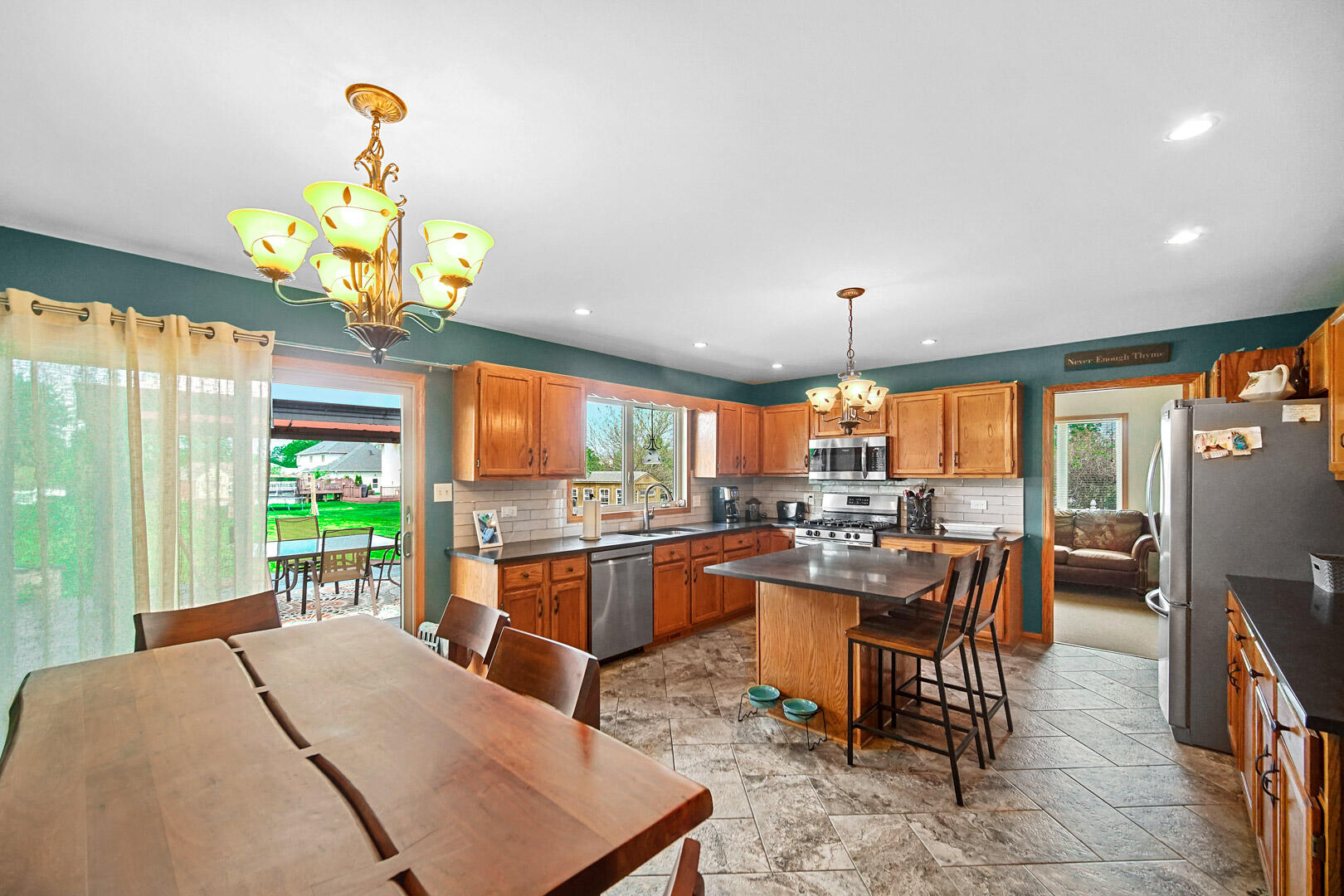 8466 Christopher Drive St. John, IN 46373 - Photo 4 of 23 a large kitchen with a table and chairs