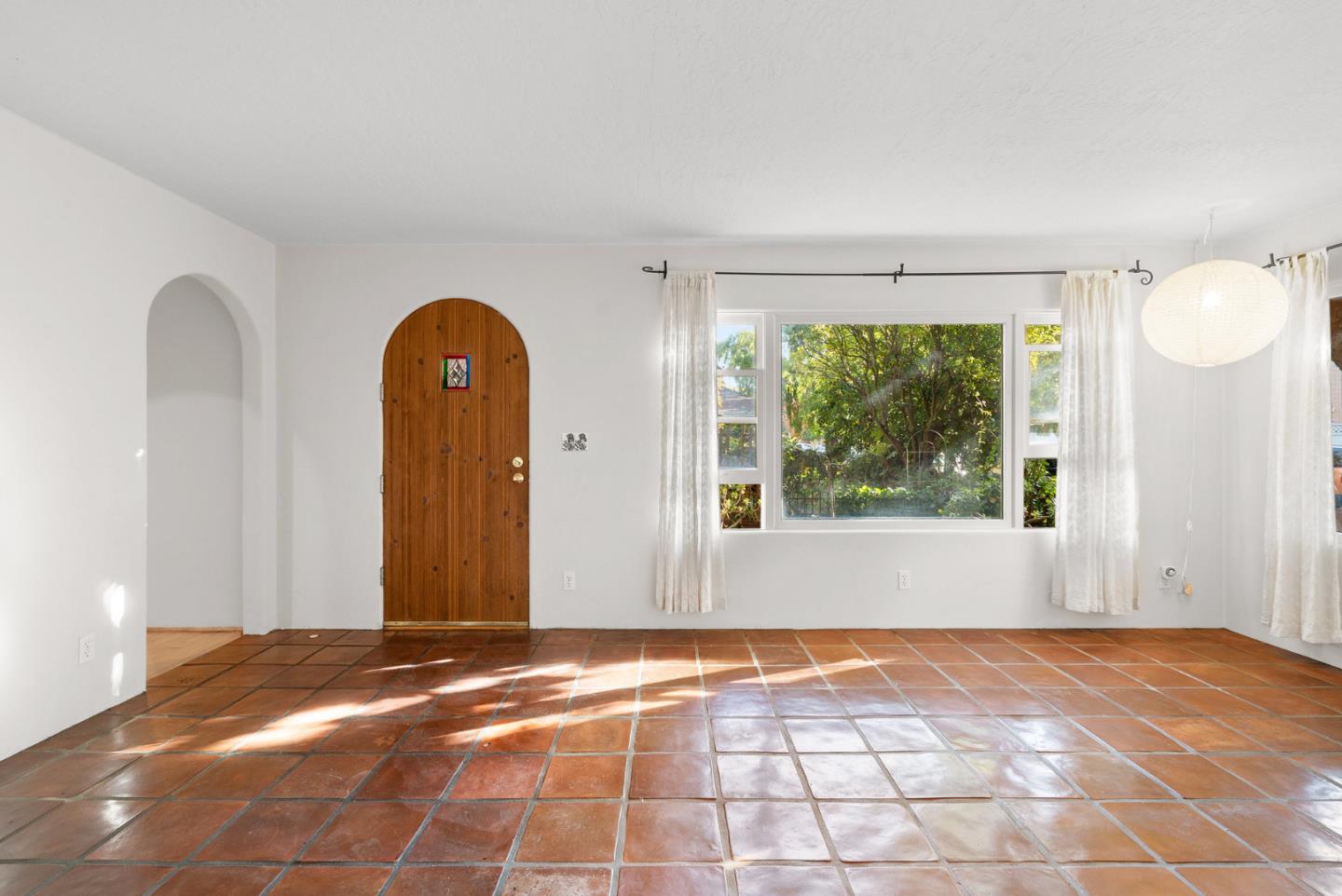 312 Elm Street Santa Cruz, CA 95060 - Photo 16 of 40 a view of a livingroom with wooden floor and a window