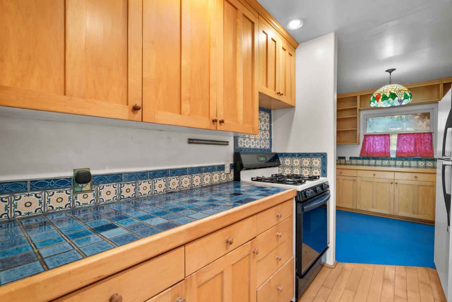 312 Elm Street Santa Cruz, CA 95060 - Photo 27 of 40 a kitchen with stainless steel appliances granite countertop a stove a sink and a white cabinets