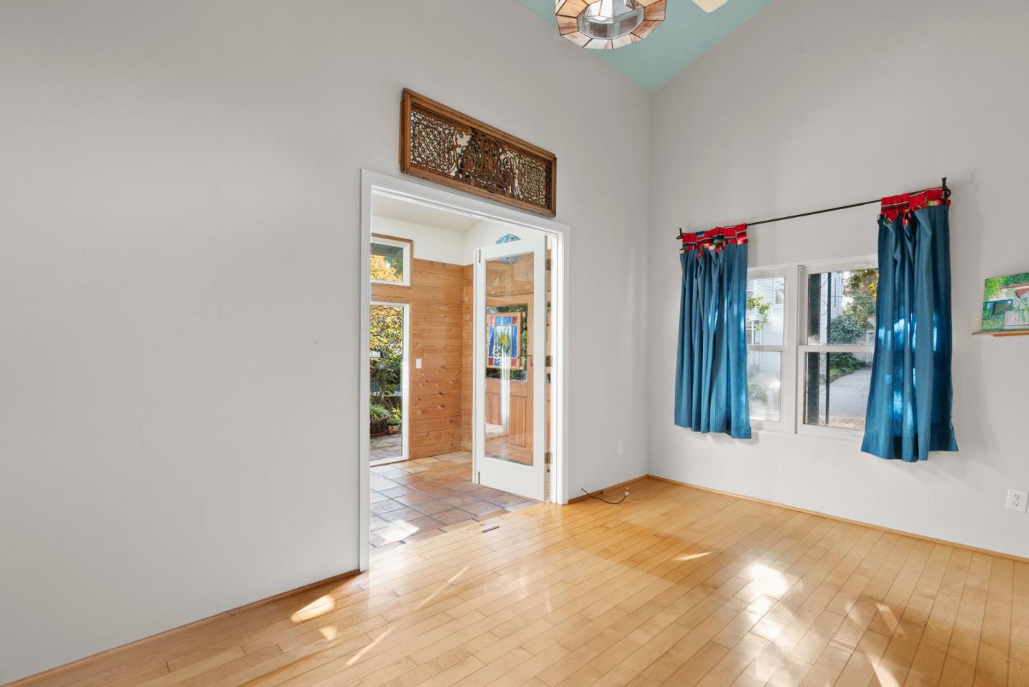 312 Elm Street Santa Cruz, CA 95060 - Photo 29 of 40 a view of an empty room with wooden floor and a window