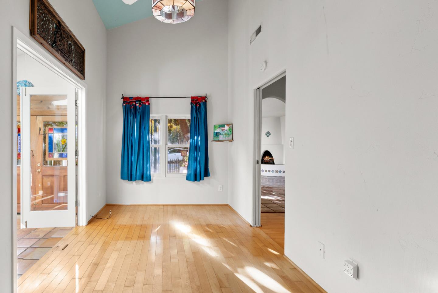 312 Elm Street Santa Cruz, CA 95060 - Photo 30 of 40 a view of a hallway with wooden floor and a living room