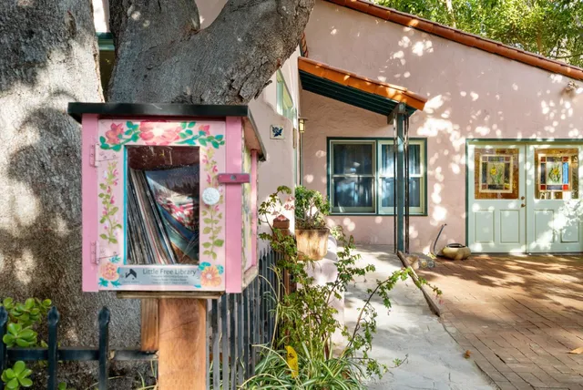 a view of a house with a small yard