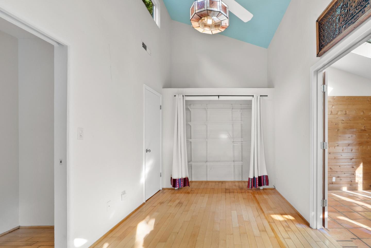 312 Elm Street Santa Cruz, CA 95060 - Photo 35 of 40 an empty room with wooden floor and windows
