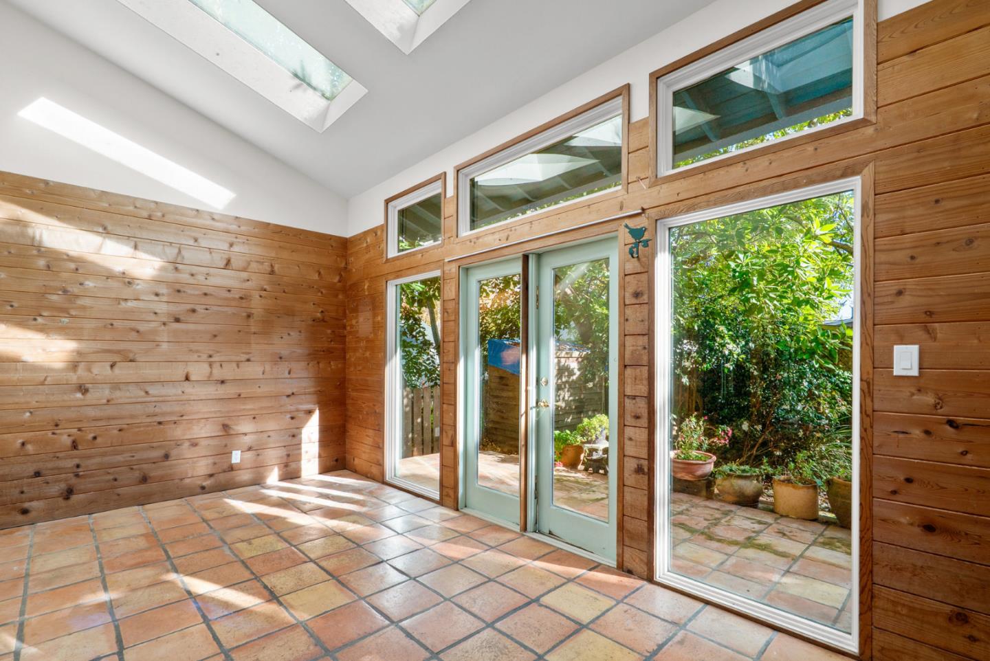 312 Elm Street Santa Cruz, CA 95060 - Photo 39 of 40 a view of a glass door and chair in a room