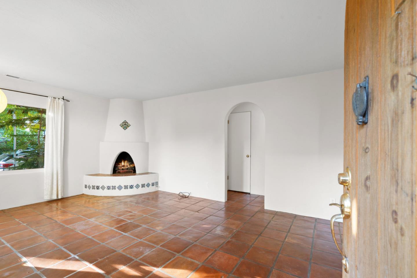 312 Elm Street Santa Cruz, CA 95060 - Photo 9 of 40 a living room with a baby crib furniture and a window