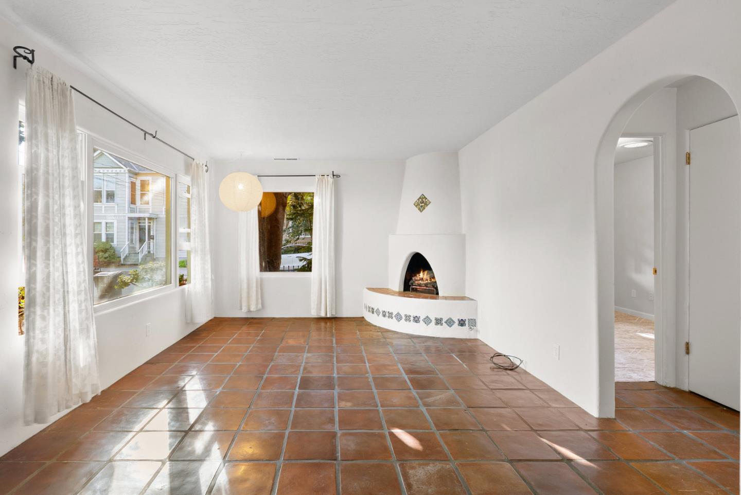 312 Elm Street Santa Cruz, CA 95060 - Photo 10 of 40 a view of a hallway with wooden floor and a living room