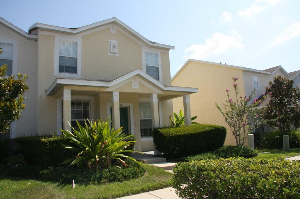 1550 Blue Magnolia Road Brandon, FL 33510 - Photo 1 of 1 a front view of a house with garden