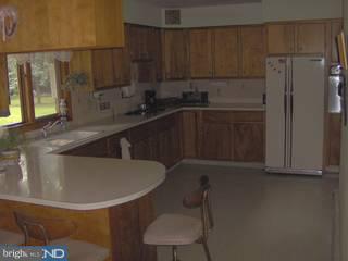 3280 Meetinghouse Road Telford, PA 18969 - Photo 3 of 6 a kitchen with a sink a refrigerator and cabinets