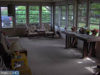3280 Meetinghouse Road Telford, PA 18969 - Photo 4 of 6 a living room with furniture and a floor to ceiling window