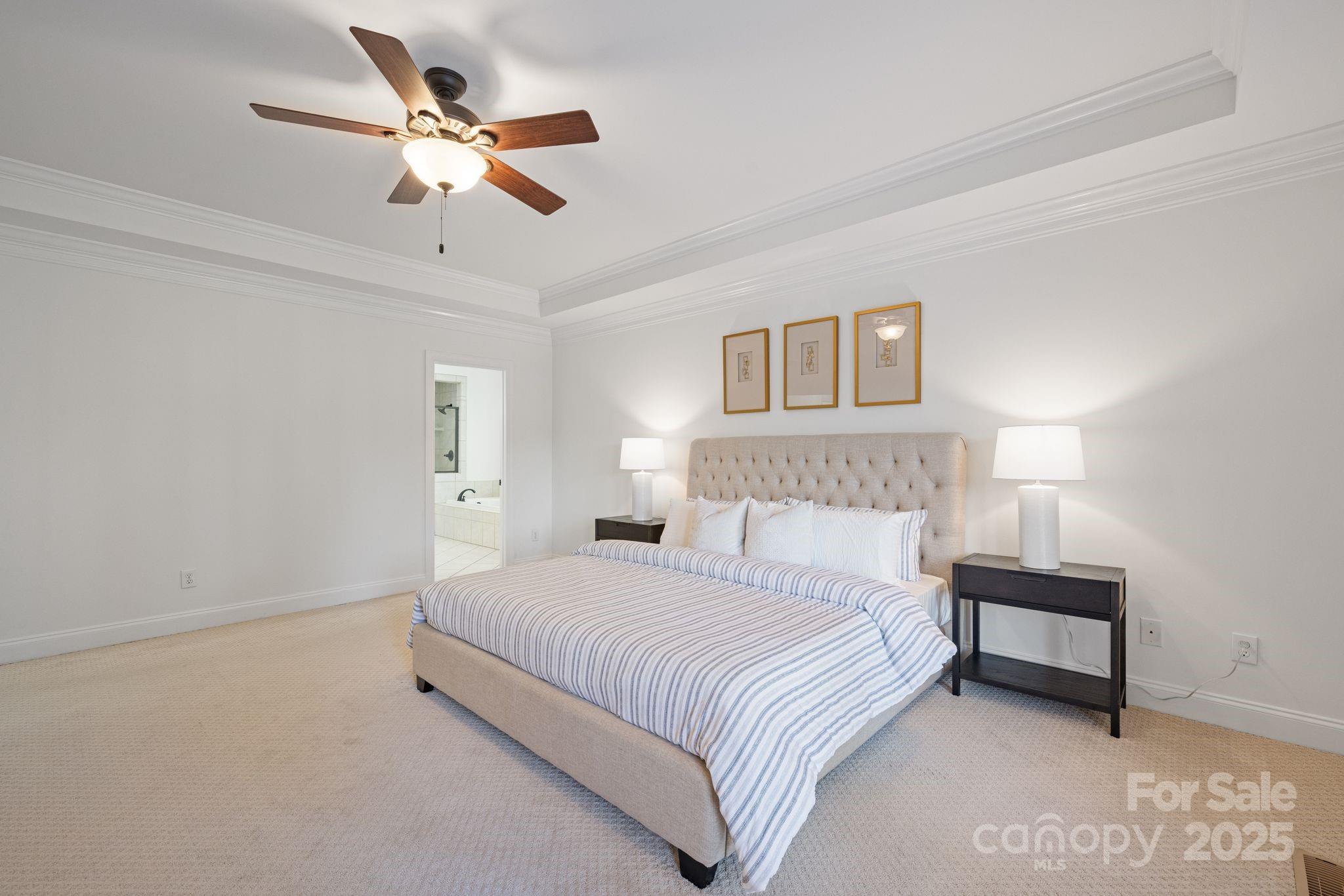 108 West Maranta Road Mooresville, NC 28117 - Photo 20 of 38 a bedroom with a bed and a ceiling fan