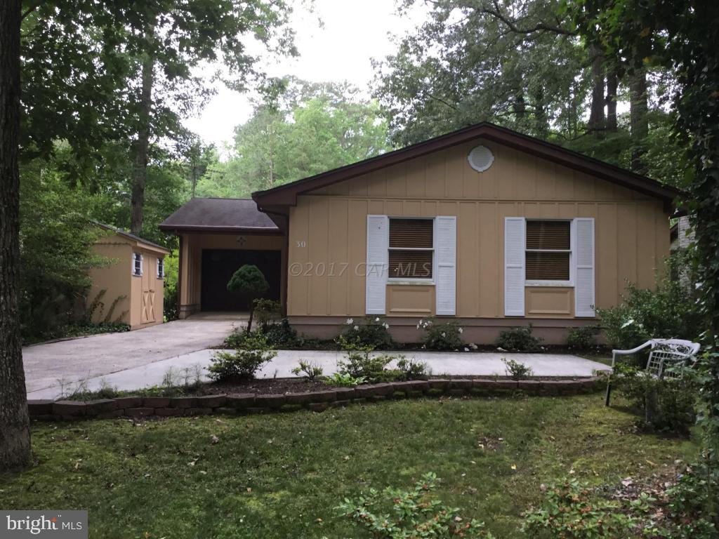 30 Brookside Road Ocean Pines, MD 21811 - Photo 2 of 27 a front view of a house with garden