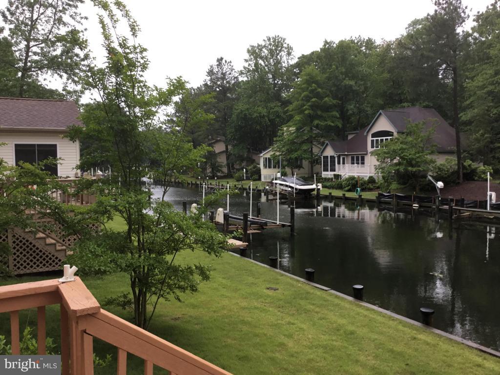 30 Brookside Road Ocean Pines, MD 21811 - Photo 13 of 27 a view of a lake with a house in the background