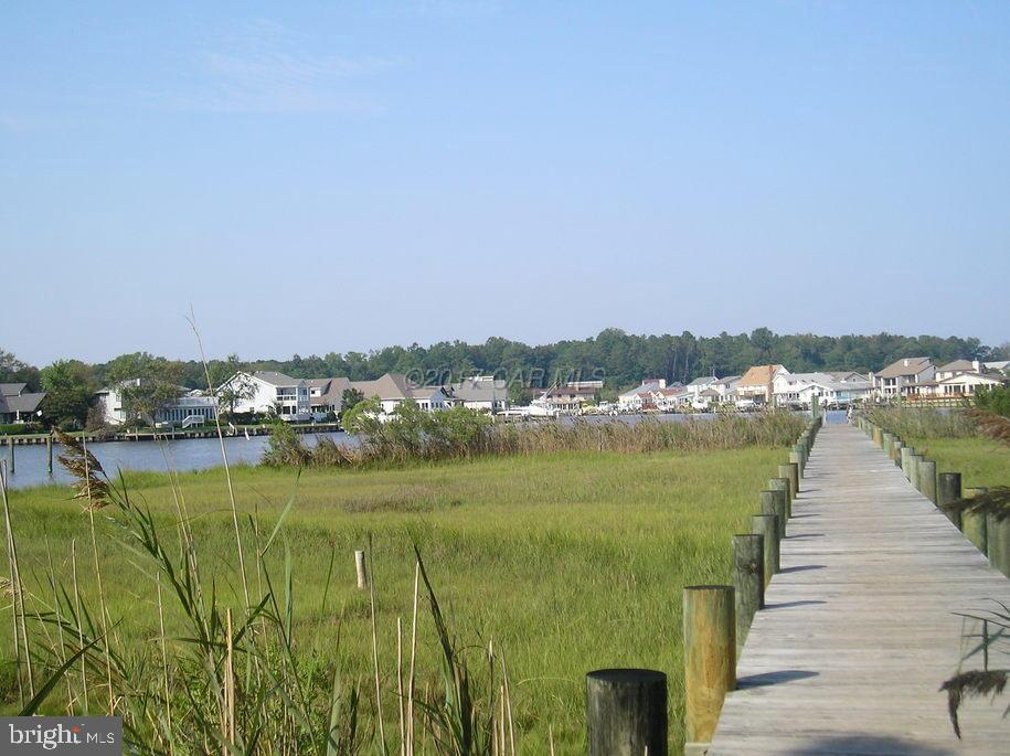 30 Brookside Road Ocean Pines, MD 21811 - Photo 20 of 27 a view of a lake with a city