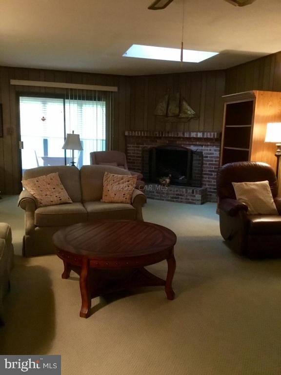 30 Brookside Road Ocean Pines, MD 21811 - Photo 5 of 27 a living room with furniture and a fireplace