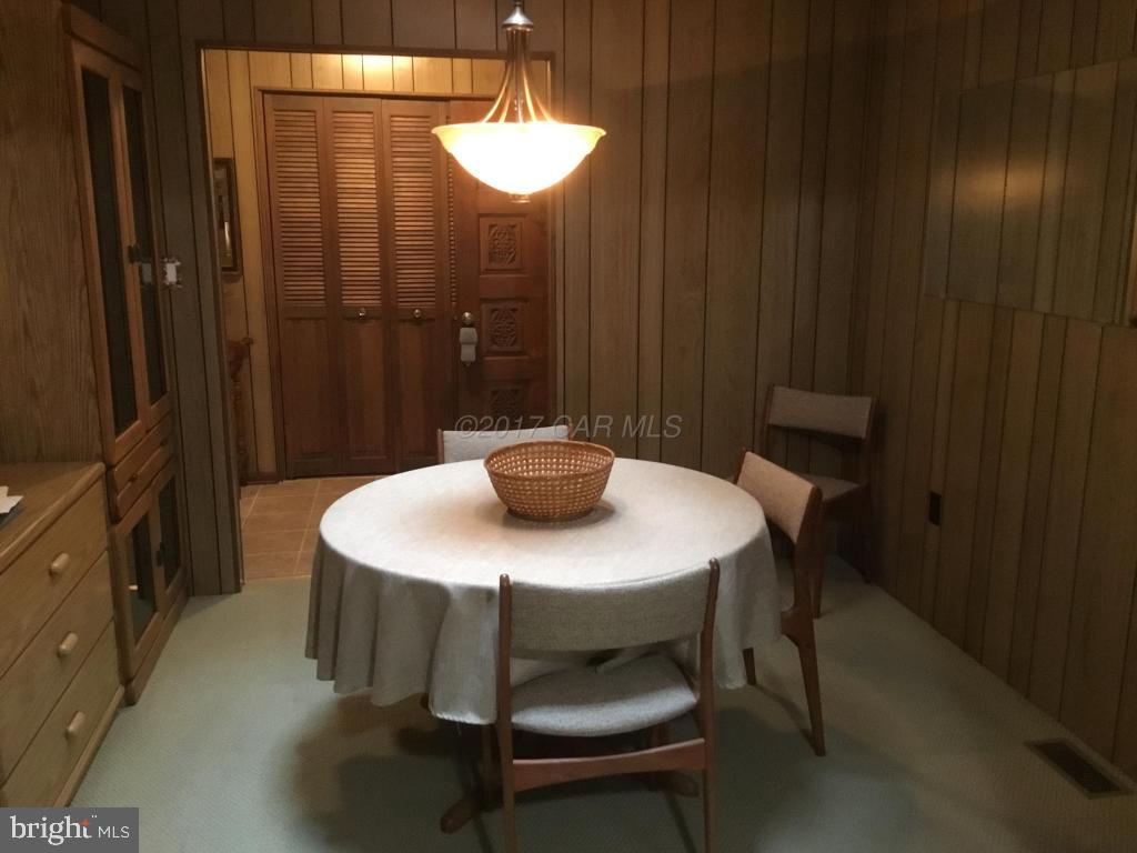 30 Brookside Road Ocean Pines, MD 21811 - Photo 7 of 27 a view of a dining room with furniture and wooden floor