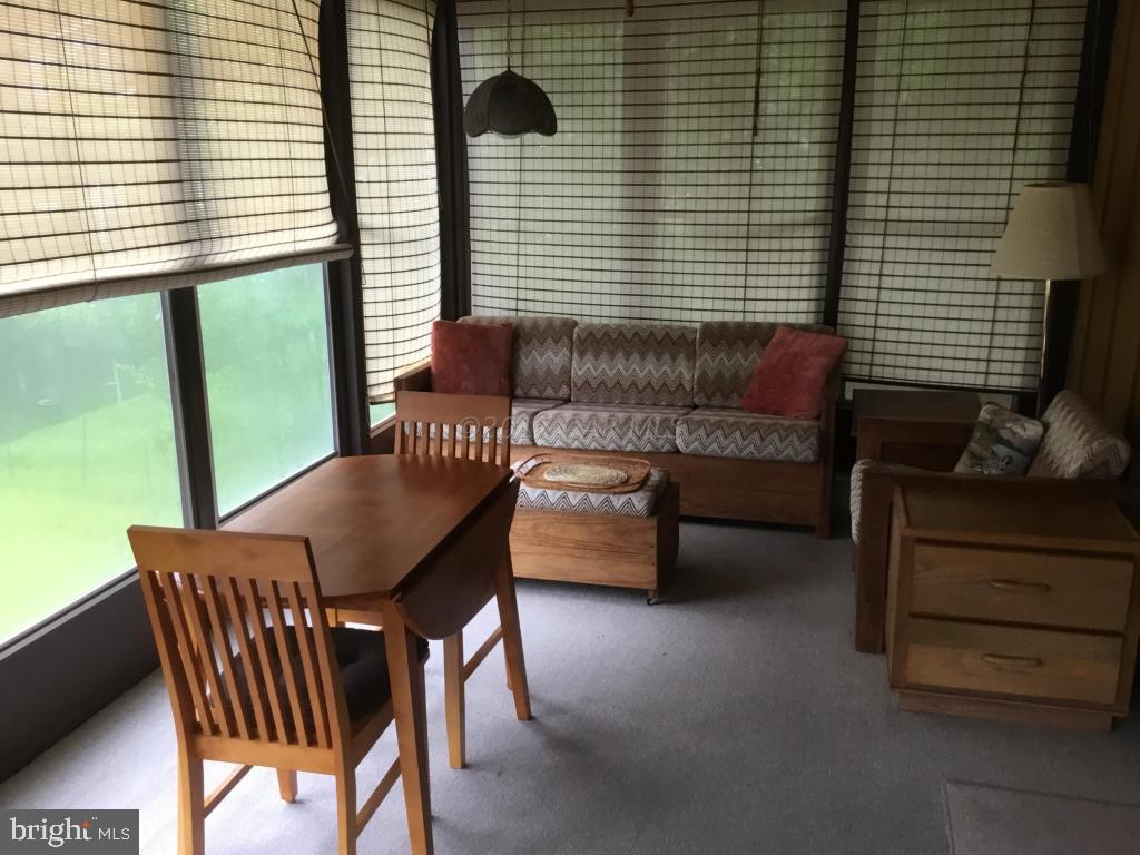 30 Brookside Road Ocean Pines, MD 21811 - Photo 8 of 27 a view of a dining room with furniture and a window