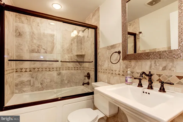 a bathroom with a bathtub and a sink