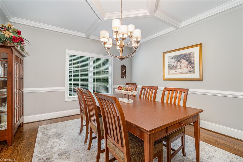 7907 Quiet Place Oak Ridge, NC 27310 - Photo 8 of 49 Formal dining room with a coffered ceiling