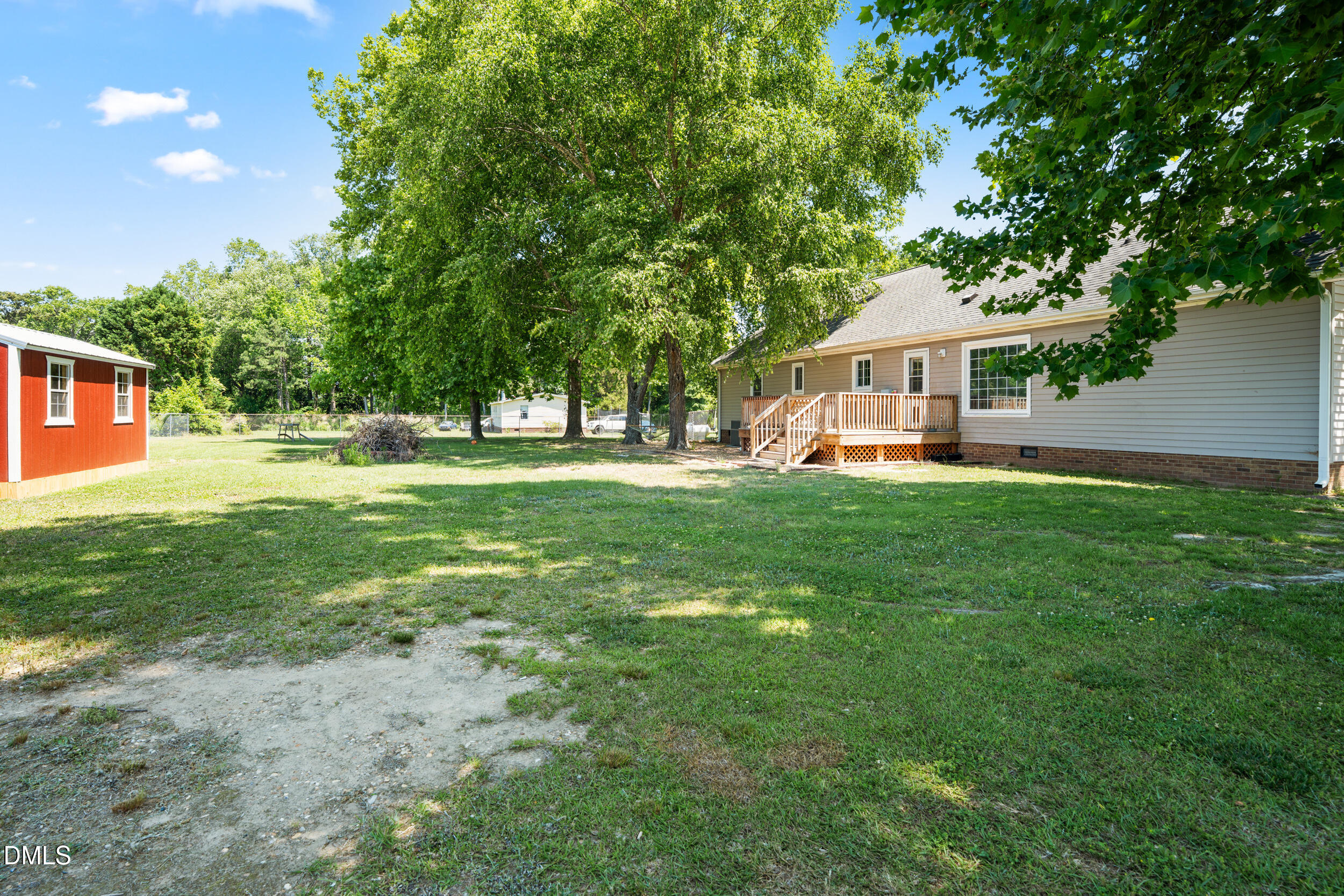 311 Bridgers Road Kenly, NC 27542 - Photo 31 of 46 a view of a house with a big yard and large trees