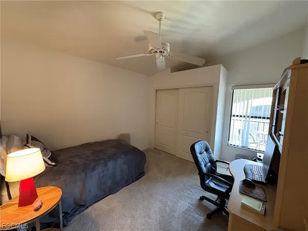 a bedroom with furniture and a window