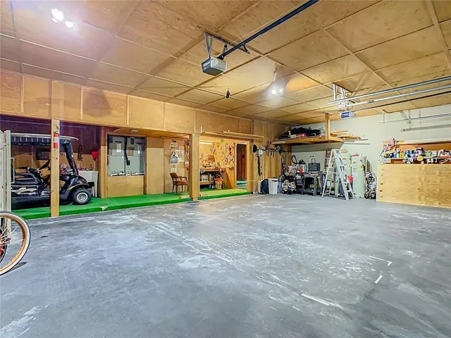 a bed room with a bed and a chair