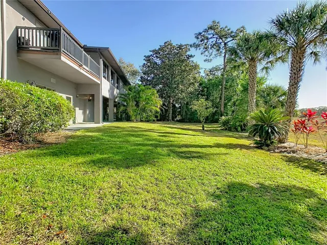 a kitchen with a stove cabinets and microwave