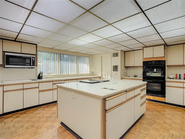 a view of a patio with table and chairs and potted plants